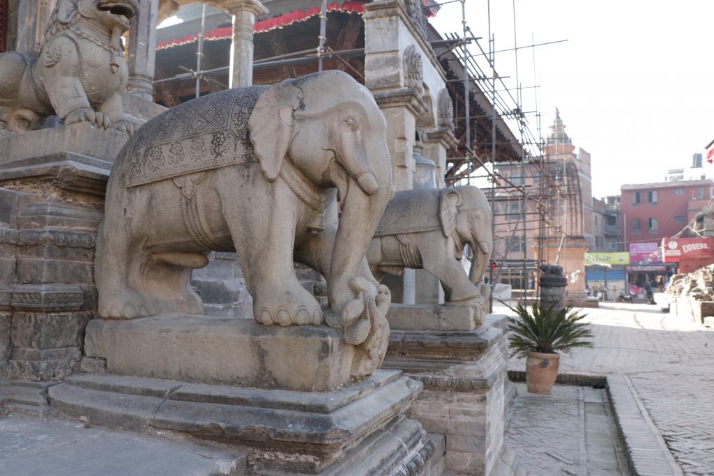 Stone images of elephant in front of the Vatsala Durga temple