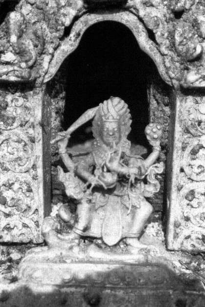 An image of the dangerous deity Bhairava in front of the Taumadhi Square image