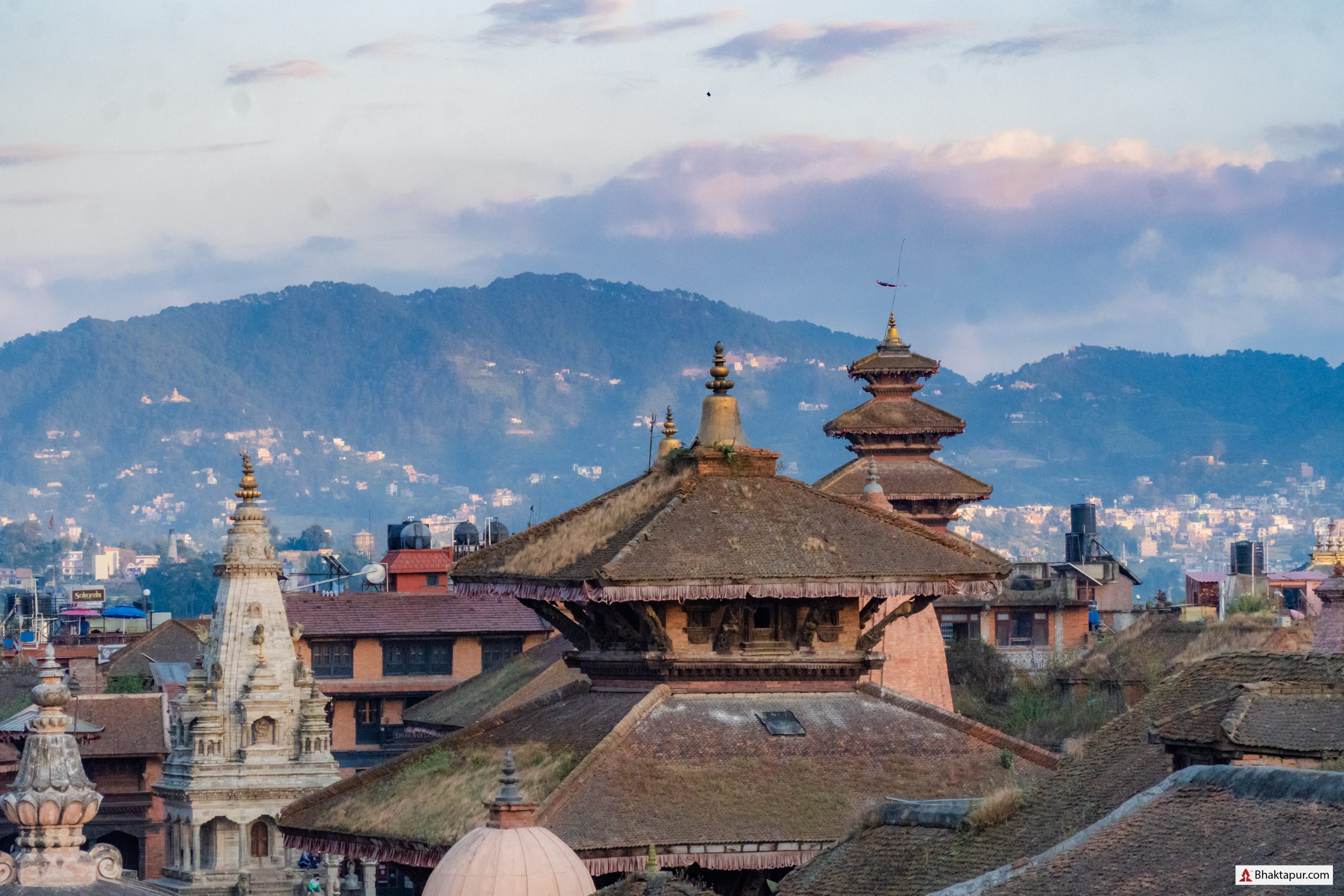 Why do people visit Bhaktapur?