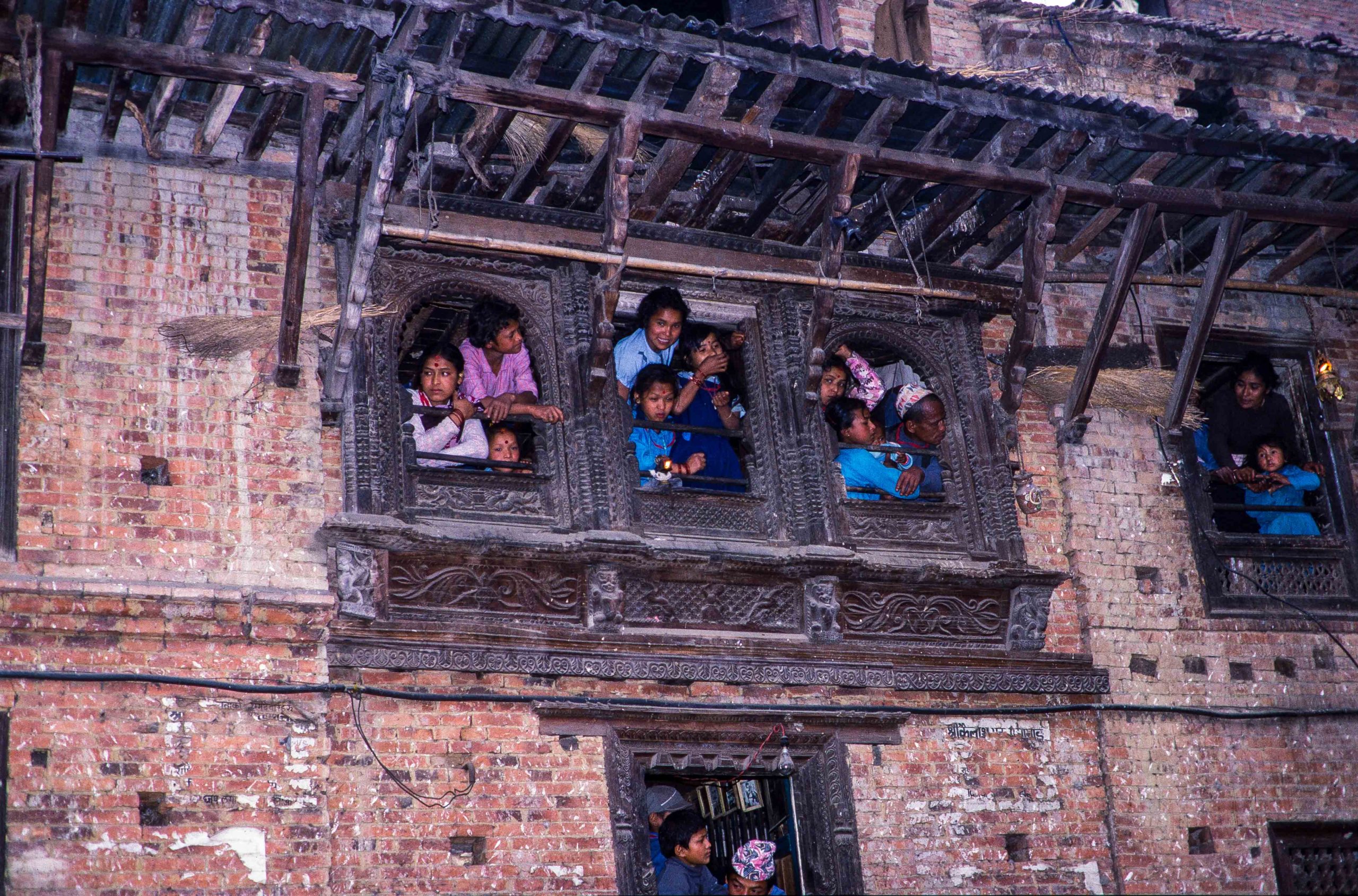 People watching Bisket Jatra from their residence image